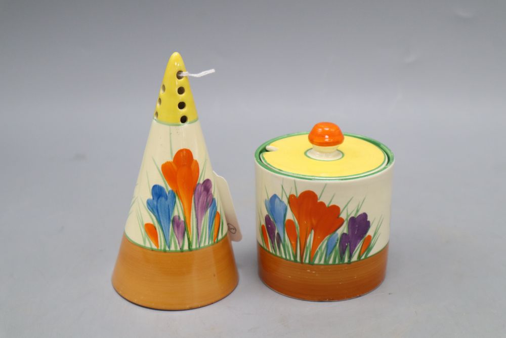 A Clarice Cliff crocus conical caster, preserve jar and a spill vase, tallest 13cm